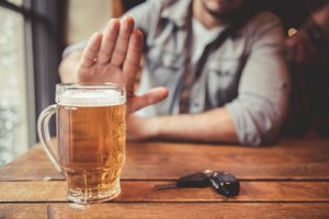 a man says no to another beer during national impaired driving prevention month 2018
