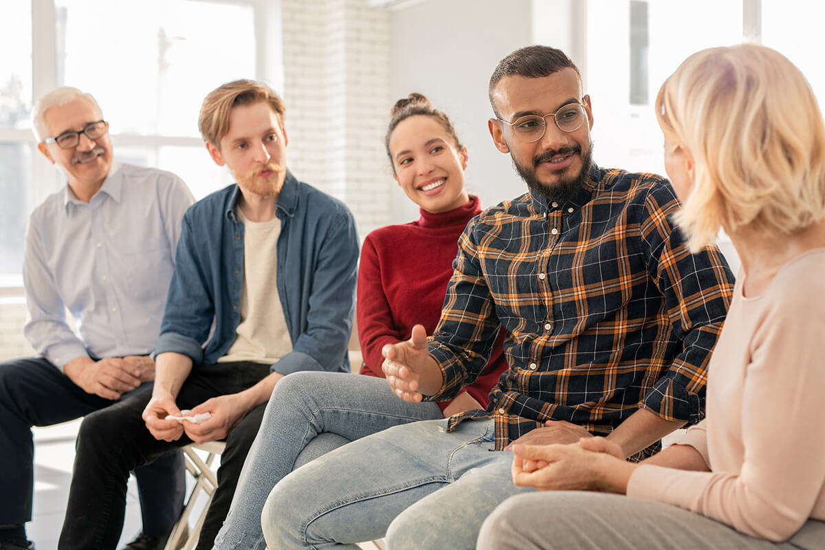 A group of people sitting in a room.